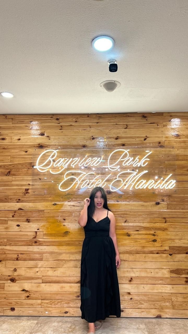 City lights at night in a red dress